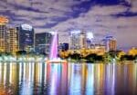 Orlando skyline at night reflecting on Lake Eola, representing Central Florida’s growth and marketing trends in 2025.