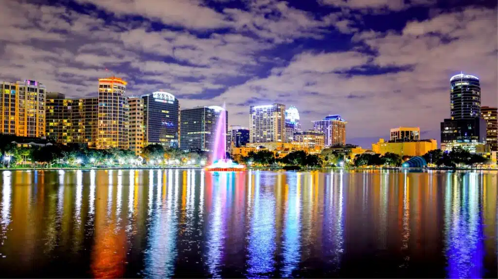 Orlando skyline at night reflecting on Lake Eola, representing Central Florida’s growth and marketing trends in 2025.